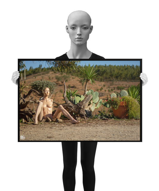 un4rt - almost human gallery poster mockup picture with a mannequin sitting outdoor in front of some plants. the poster is held by a mannequin.