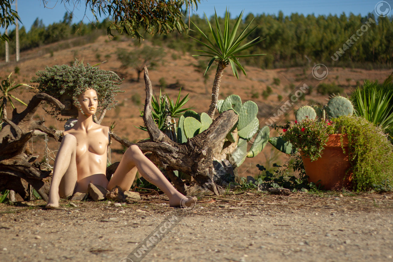 un4rt - almost human gallery poster mockup picture with a mannequin sitting outdoor in front of some plants