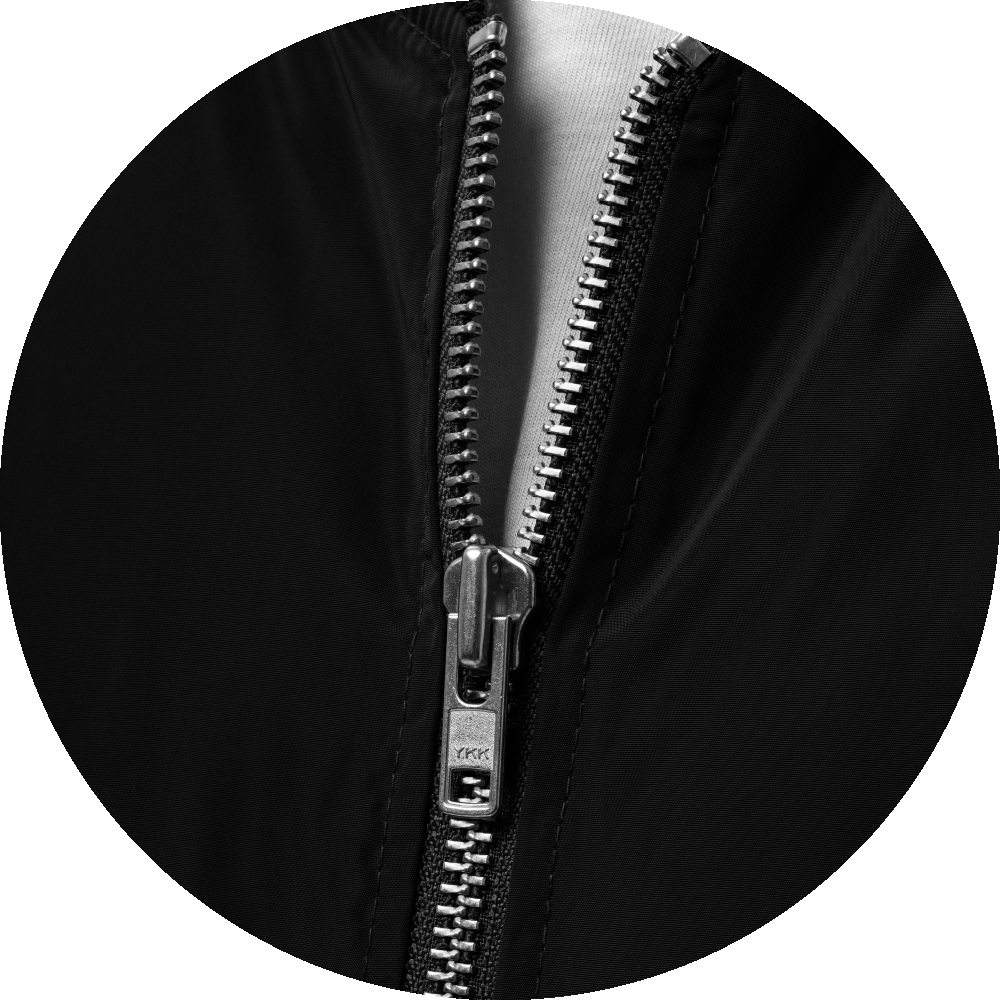 un4rt - the image shows details of a black bomber jacket with a metallic "YKK"-zipper.