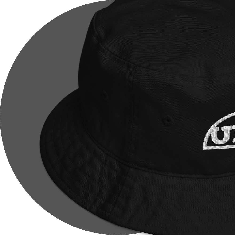 un4rt - the image shows details of a black cotton bucket hat with a part of a white embroidery of a splitted "UN4RT"-logo.