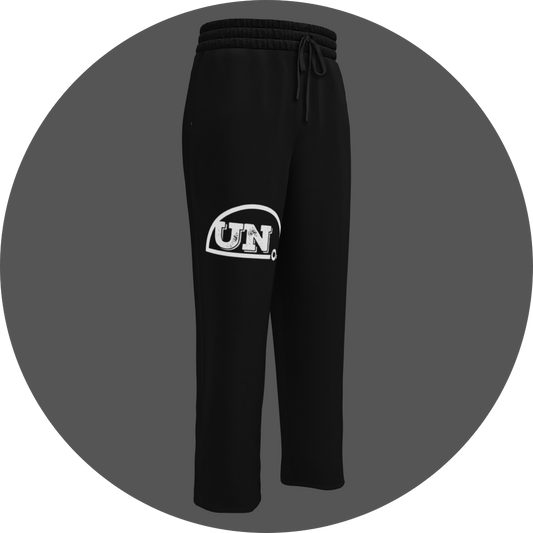 un4rt - the image shows the front of a black jogger pant with a white print of the upper part of the "UN4RT"-logo on the right leg.