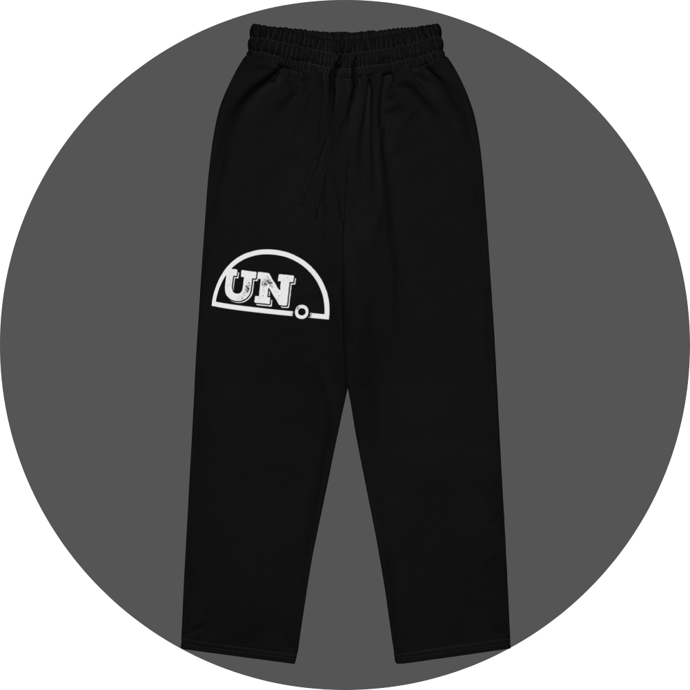 un4rt - the image shows the front of a black jogger pant with a white print of the upper part of the "UN4RT"-logo on the right leg.