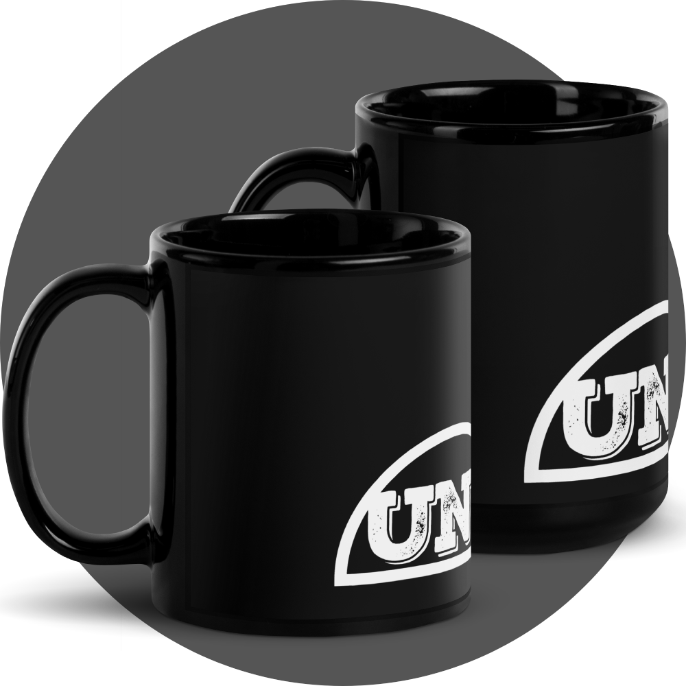 un4rt - the image shows the right side of two black mugs in different sizes with a part of a white print of a splitted "UN4RT"-logo on them.