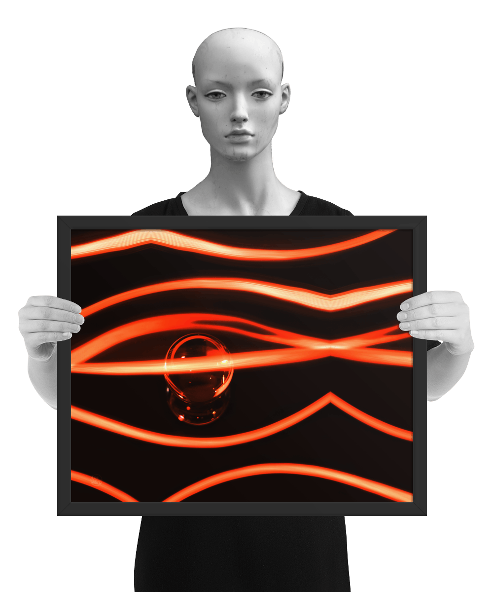 un4rt - the photographie has a black background with a glasball in the middle, placed on a mirror. the glasball is reflecting red light. various red lightlines around the glasball. the image is framed and presented by a mannequin in black and white.