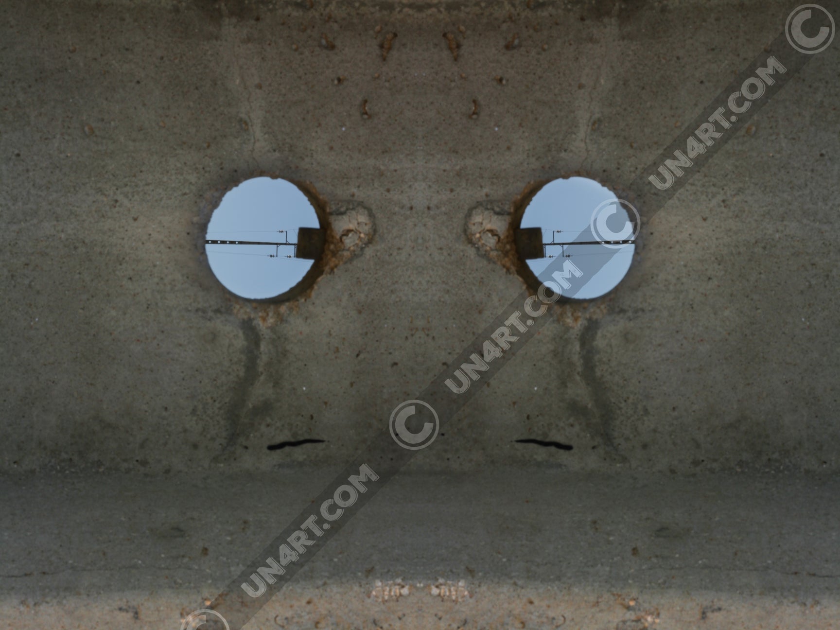 un4rt - the photographie shows a section of an concrete pole with a holes. the whole image contains the photographie for 2 times and one of the photographies is mirrored.
