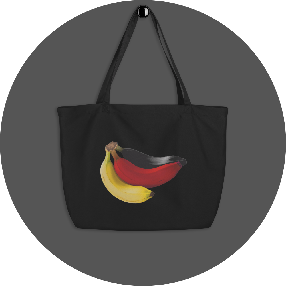 un4rt - the image shows one side of a black cotton tote bag with a big print on it. the print shows three bananas colored in black, red and yellow.