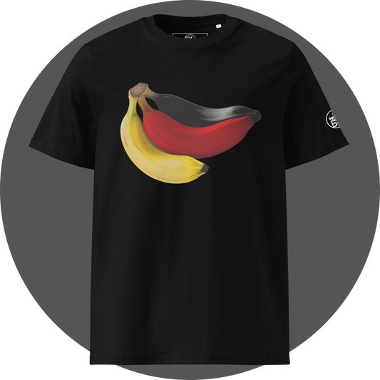 un4rt - the image shows the front of a black cotton t-shirt with a print on the breast. the print shows three bananas colored in black, red and yellow. the left arm shows a part of a white print of the "UN4RT"-logo.