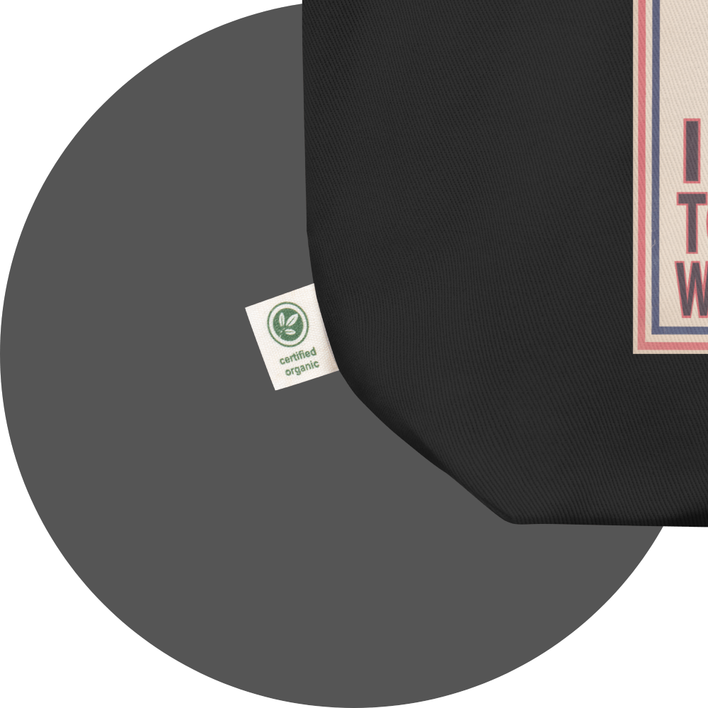 un4rt - the image shows details of a black cotton tote bag with parts of a print. a white label is attached to the tote bag. the print n the label reads: "certified rganic".