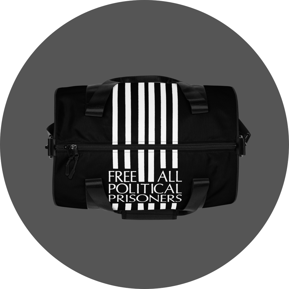 un4rt - the image shows the top of a black tubular gym bag with six vertical white stripes in the middle of the center. the stripes are interrupted with text. the text reads:"free all political prisoners".