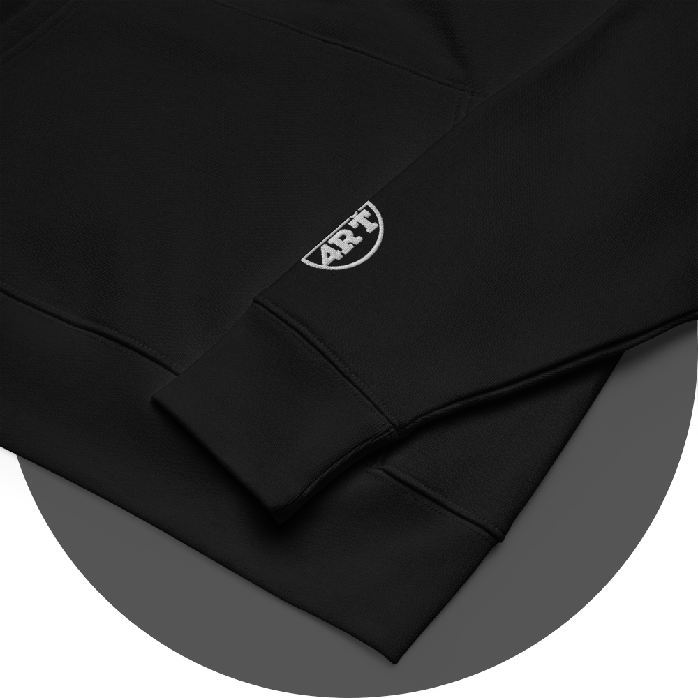 un4rt - the image shows details of black cotton hoodie with a white "UN4RT"-logo embroidery on the left sleeve. only the lower part of the logo is visible.