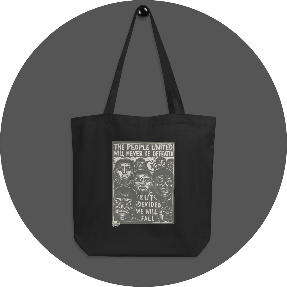 un4rt - the image shows a black cotton tote bag with a big 2 colored print in the center. the print shows prostestors of different races. the text reads: "the people united will never be defeated - but devided we will fall".