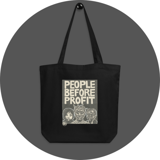 un4rt - the image shows a black cotton tote bag with a big 2 colored print in the center. the print shows three young humans of different races. the text reads: "people before profit".