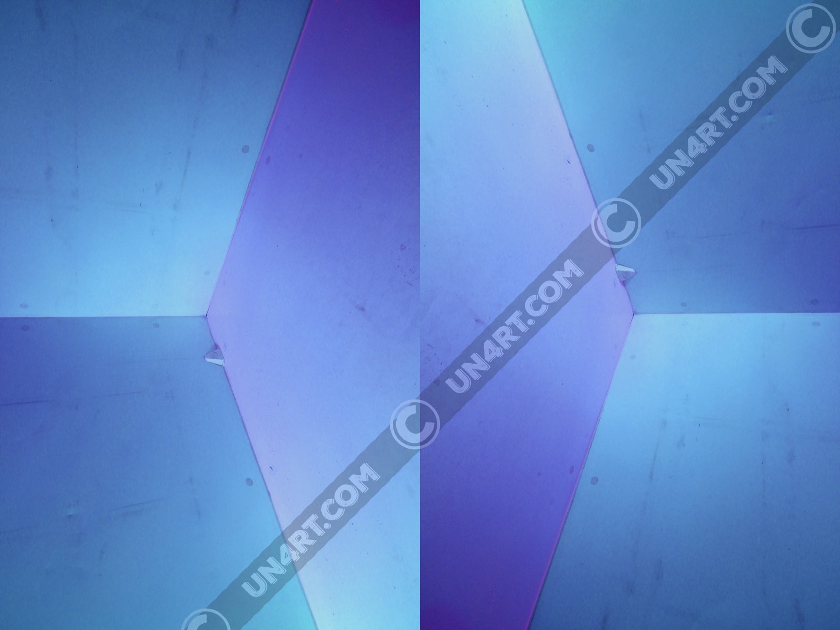 un4rt - the photographie shows an upper corner of a cooling cell, light in blue colors with gradients. the whole image contains the photographie for 2 times and one of the photographies is mirrored.