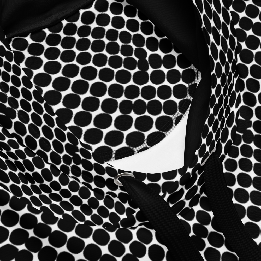 un4rt - the image shows details of a hoodie with black dots on a white background. the dots are irregular but mainly round. the dots are arranged in soft curves. some of the dots touch each other and merge.