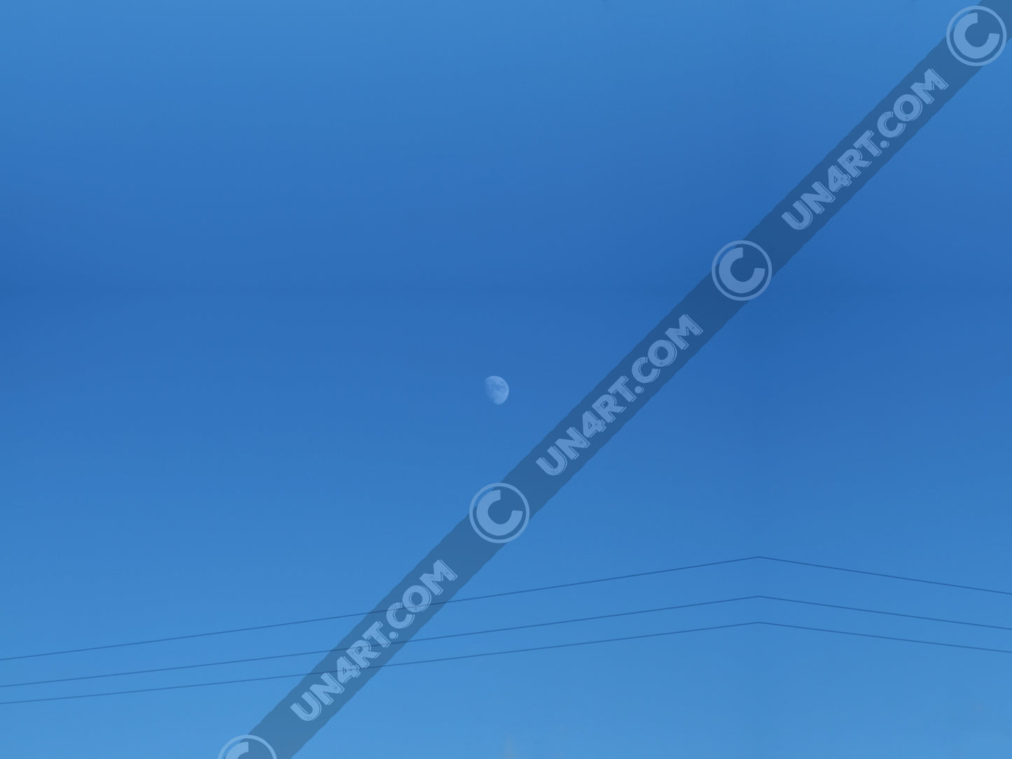 un4rt - the photographie shows a completely blue sky with a small moon in the center. some power lines cross the image on the bottom.