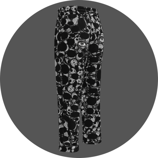 UN4RT eyesolation all-over-print jogging pants back left view – black sweatpants with dense abstract pattern of black organic blob shapes and grey brushstroke texture, subtle eye motif visible in print, elasticated waistband, straight leg cut.