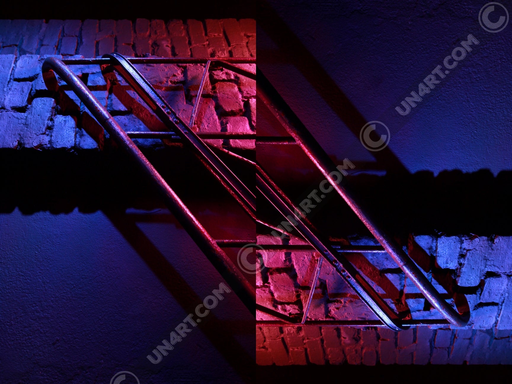 un4rt - the photographie is doubled and then mirrored. both photographies together create the final image. the image shows a brick wall and a wall with a handrail. the illumination changes from red to blue.