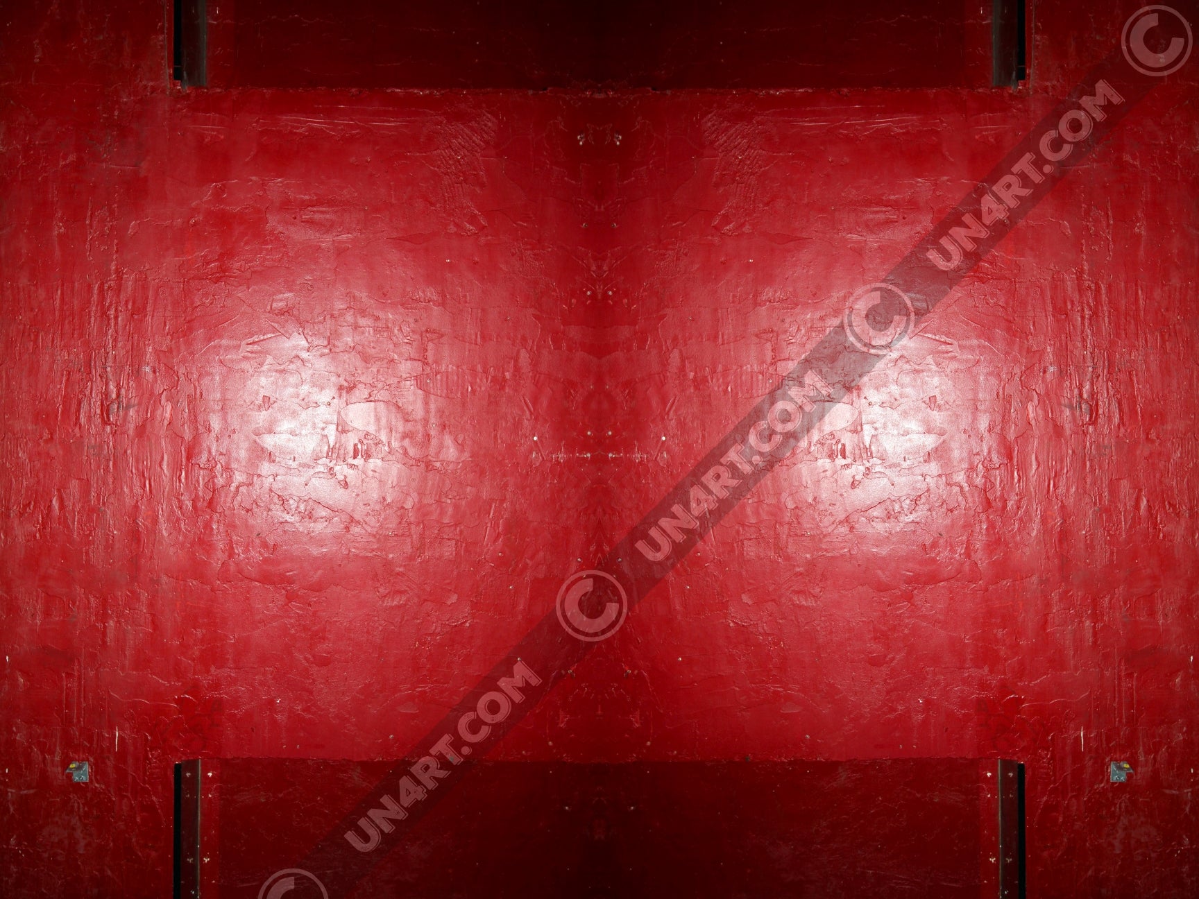 un4rt - the photographie is doubled and then mirrored to create the final image. the image shows a structured red wall with some signs of destruction and a bright reflection of a light in the center. darker parts on the top and the bottom.