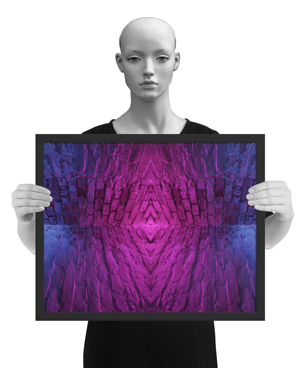 un4rt - the photographie is doubled and then mirrored to create the final image. the image shows the corner of two old brick walls. the colors of the walls range from purple and pink to blue. the image is framed and presented by a mannequin in black and white.