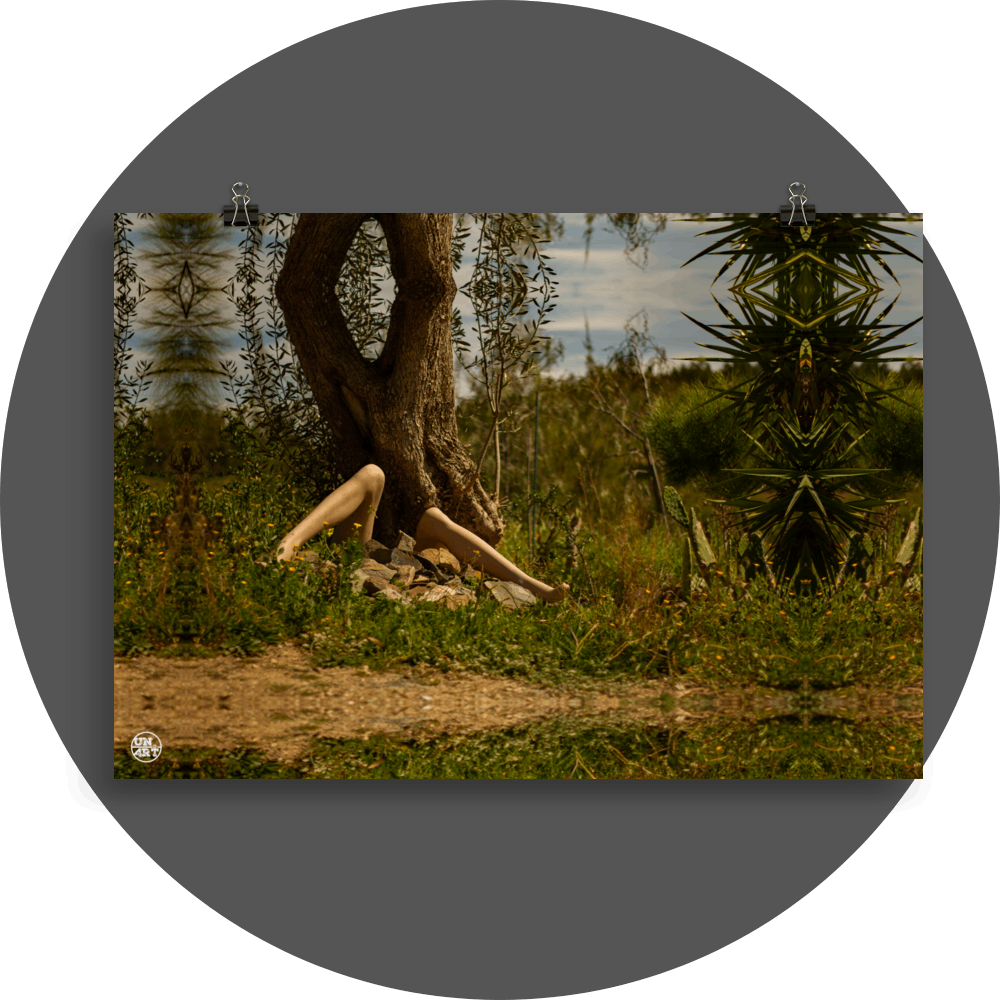 un4rt - a photographie that is mirrored on all sides. the image shows the legs of a mannequin in front of an old olive tree trunk. stones between the legs. it seems like the mannequin is stuck under the trunk. a lot of wild growing greenery around. hills with trees and a cloudy sky in the background.