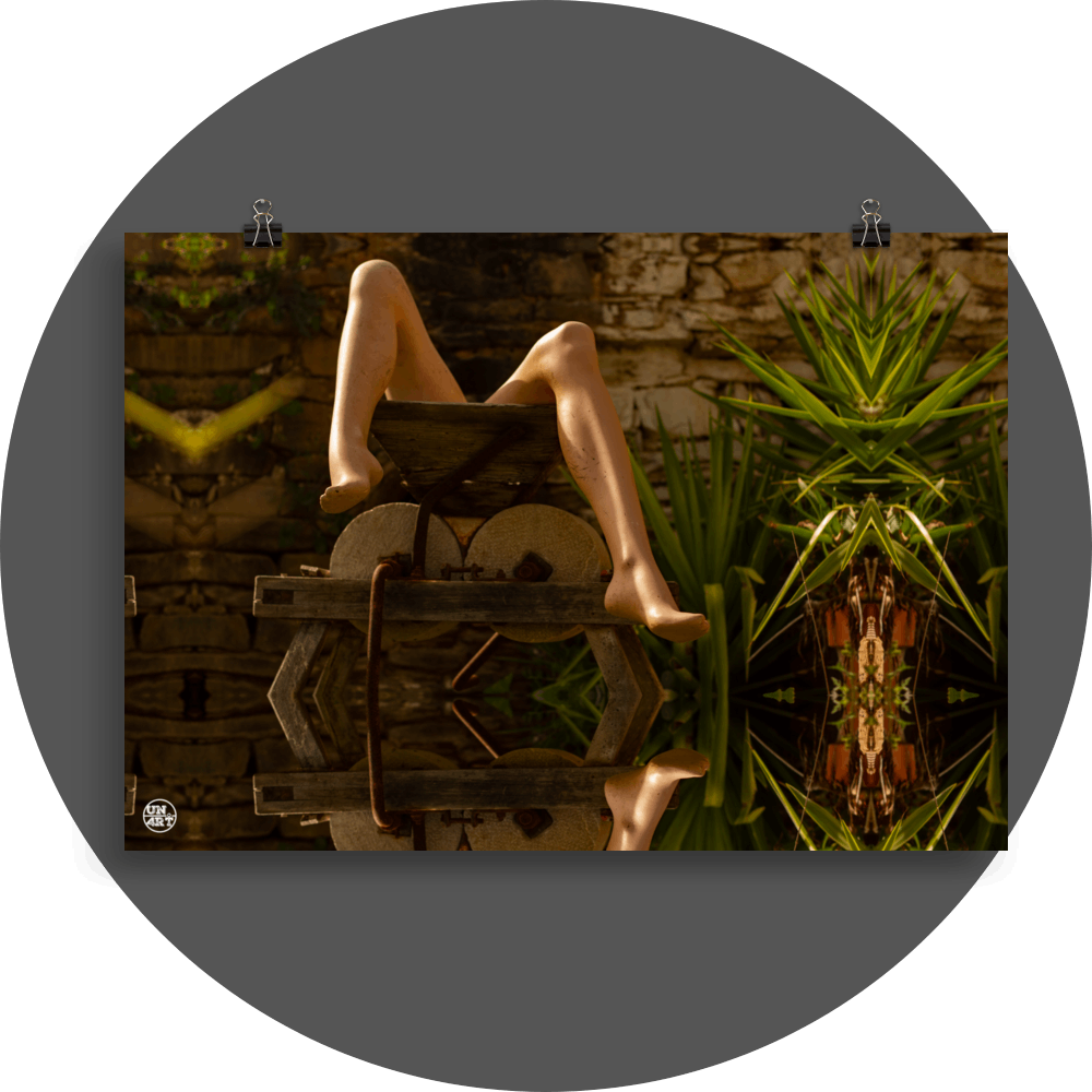 un4rt - a photographie that is mirrored on all sides. the image shows the legs of a mannequin which seems to be stuck inside an old olive mill. some yucca plants next to the mill. ancient stone wall in the background.