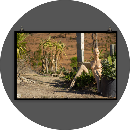 un4rt - almost human gallery poster mockup picture with a mannequin sitting outdoor in between some plants