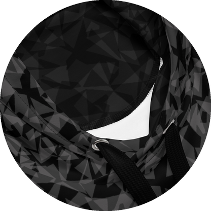 un4rt - the image shows details of a hoodie with two layers of different and arbitrary angular shapes that are superimposed and shine through each other. the superimposition results in the color tones light grey, dark grey and black. the overall structure is chaotic but uniform.