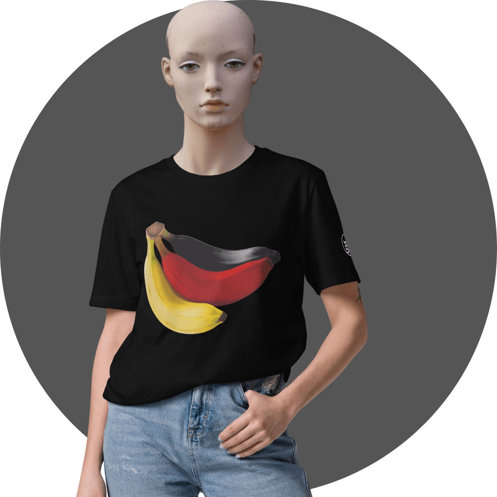 UN4RT black t-shirt, large photorealistic banana bunch graphic in yellow, red and dark grey tones centered on chest, UN4RT logo patch on left sleeve, relaxed fit, female mannequin front view, grey circular background.