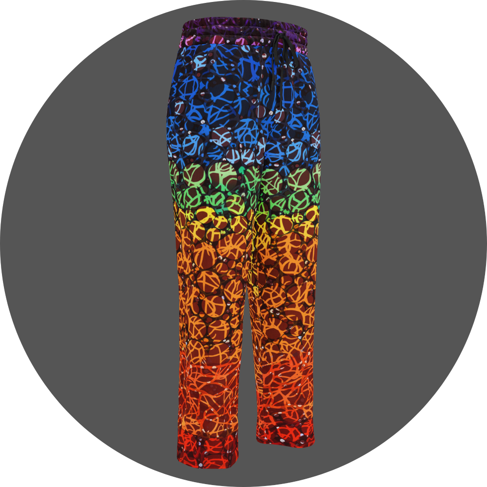UN4RT chakra dots all-over-print jogging pants front right view – rainbow gradient sweatpants with anarchic graffiti lettering in blue, green, yellow and orange tones, scattered white rhinestone dots, elasticated drawstring waistband, straight leg cut.