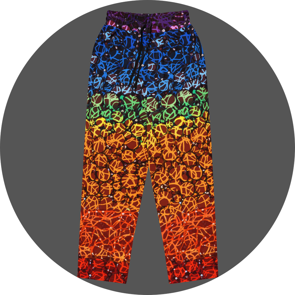 UN4RT chakra dots all-over-print jogger front flat – rainbow gradient sweatpants with anarchic graffiti lettering and circle motifs, vertical colour flow from deep purple and blue at waistband through green, yellow, orange to deep red at hem, scattered white rhinestone dots throughout, elasticated drawstring waistband.