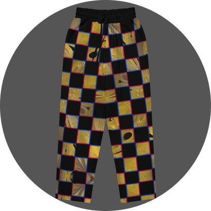 UN4RT cheesy chess all-over-print jogging pants front flat – black sweatpants with checkerboard pattern of alternating black and textured golden yellow squares with organic holes and molten surface, chromatic aberration effect in pink and blue at square edges, elasticated drawstring waistband.
