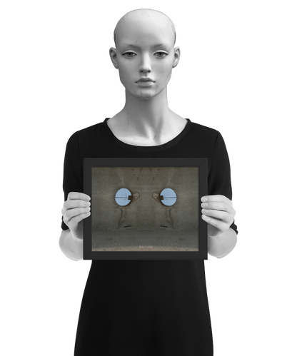 un4rt - the photographie shows a section of an concrete pole with a holes. the whole image contains the photographie for 2 times and one of the photographies is mirrored. the image is framed and presented by a model in black and white.