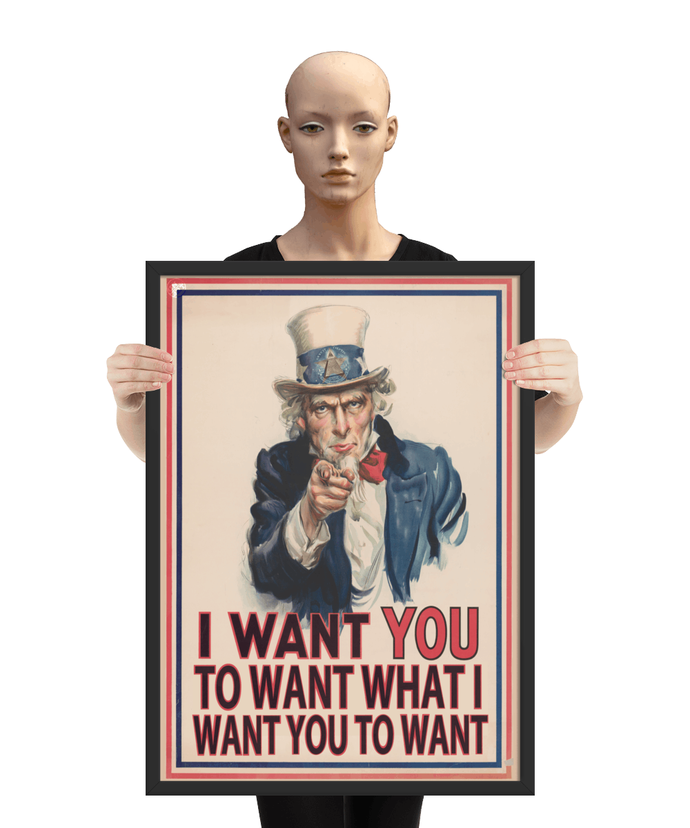 un4rt - the image shows a mannequin holding a framed poster with an edited picture of a famous "uncle sam" painting where he is pointing at the viewer with his index finger. the picture is framed with red and blue lines. the text below the picture reads: "I want you to want what  want you to want".