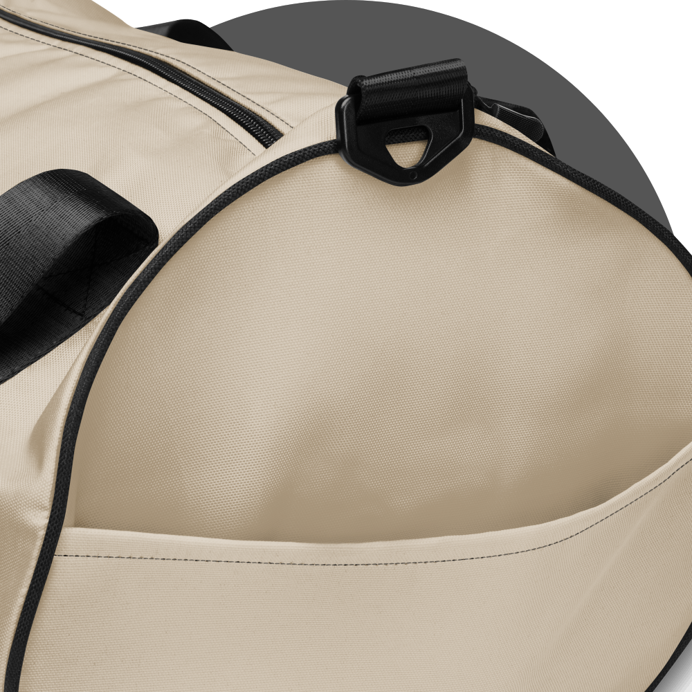 un4rt - the image shows details of one side of a tubular gym bag with an oystrich colored fabric. the frame straps are black. the side area has a pocket.