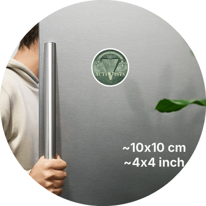 un4rt - the image shows a part of a fridge-door that is opened.the fridge-door has a round magnet on it. the picture on the magnet shows an edited part of a section of a 1 dollar note with an inverted pyramid. the all-seeing eye is at the top, on the wide part of the pyramid. the banderole reads "conspiracy-disclosure" and the pointed part of the pyramid reads "activists". measurements of the magnet in cm and inch are written on the right sight of the image.