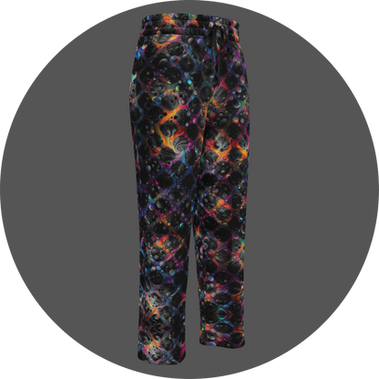 UN4RT cosmic grid all-over-print jogging pants front right view – dark sweatpants with three-dimensional black sphere and bubble cluster pattern, iridescent neon rainbow glow in pink, blue, orange and teal between forms, elasticated drawstring waistband, straight leg cut.