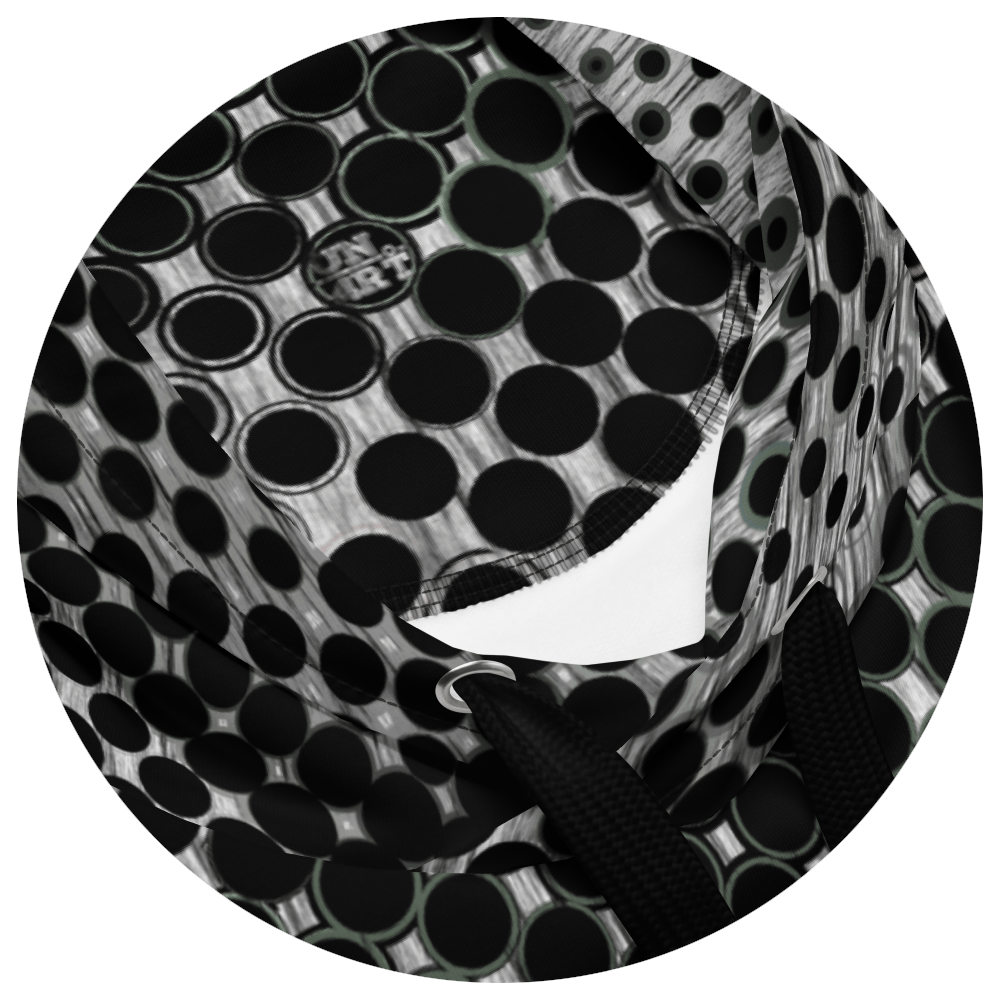 UN4RT doterium hoodie hood detail – circular close-up of drawstring hood opening showing black halftone dot pattern with solid and hollow ring forms on white and grey fabric, UN4RT logo embroidered at chest, white inner lining and black metal eyelet visible.