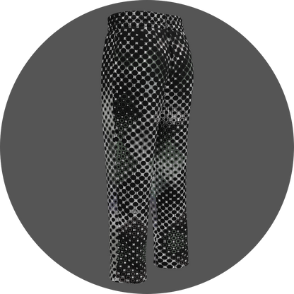 UN4RT doterium all-over-print jogging pants back left view – white sweatpants with halftone dot pattern of solid black circles fading into hollow rings, small UN4RT logo visible at lower leg, elasticated waistband, straight leg cut.
