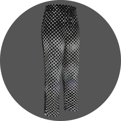 UN4RT doterium all-over-print jogging pants front right view – white sweatpants with halftone dot pattern of solid black circles fading into hollow rings, elasticated drawstring waistband, straight leg cut.
