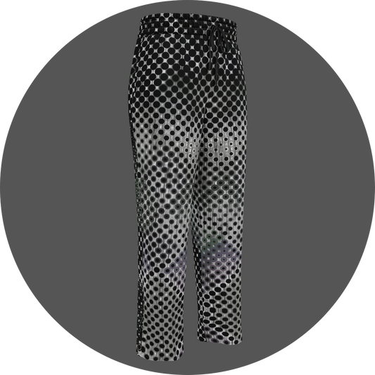 UN4RT doterium all-over-print jogging pants front right view – white sweatpants with halftone dot pattern of solid black circles fading into hollow rings, elasticated drawstring waistband, straight leg cut.