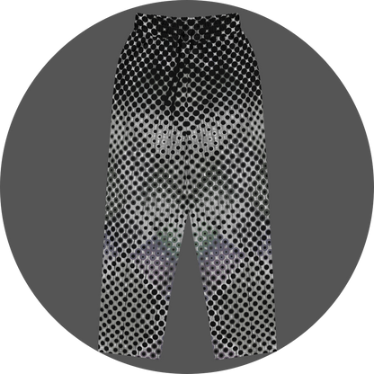 UN4RT doterium all-over-print jogging pants front flat – white sweatpants with dense halftone dot pattern of solid black circles fading into hollow rings, gradient transition from opaque to transparent, elasticated drawstring waistband.