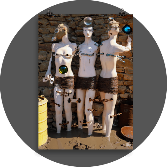 un4rt - combination of photographie and ai-art. three mannequins are chained together. they are standing in mud, in front of an old stone wall. one of the mannequins is looking into the camera, the others are wearing a gas mask and face away from the camera. each mannequin is in a relationship with a glas orb.
