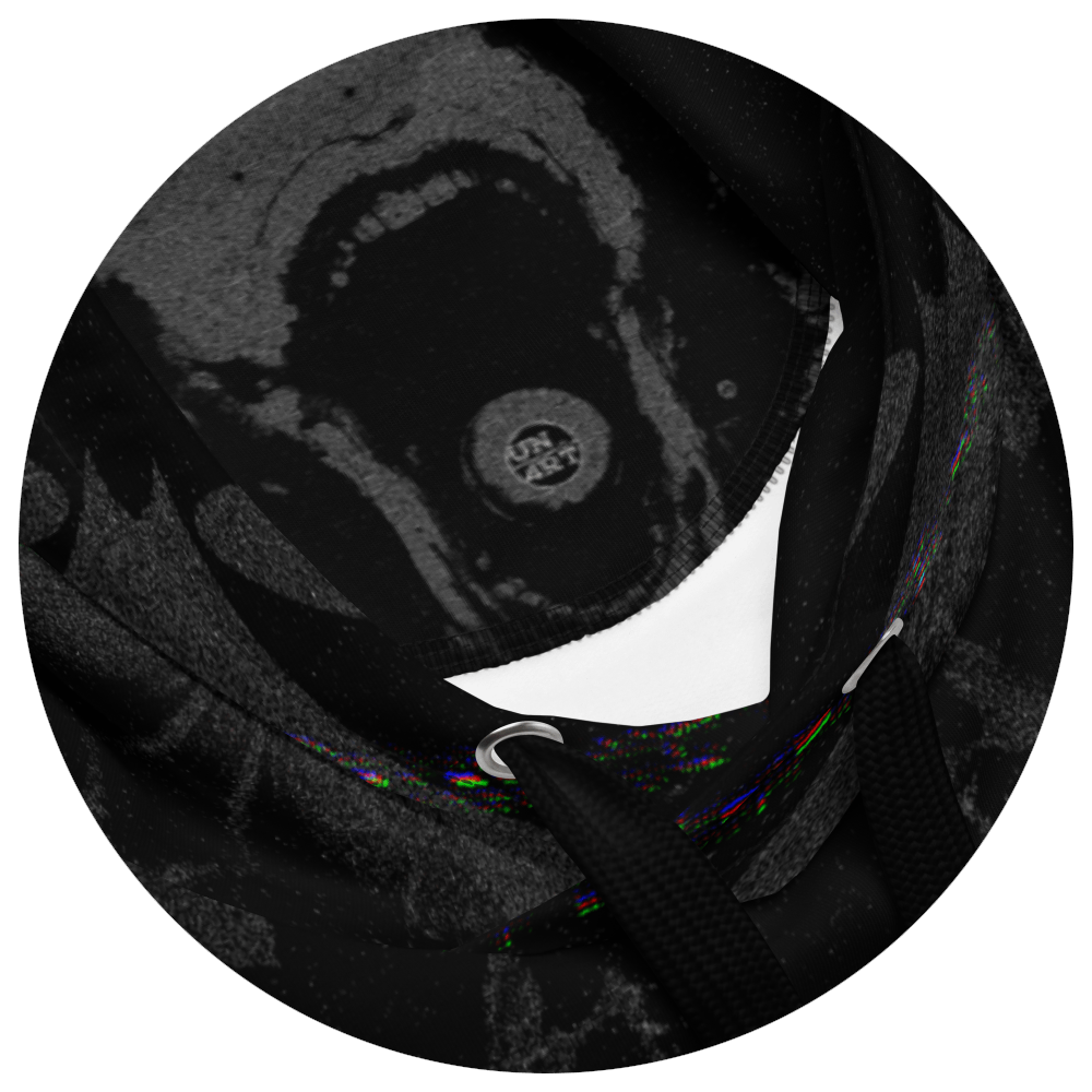 UN4RT - EYESCREAM hoodie interior detail – circular close-up of dark surrealist art print on hood lining, showing screaming face with single eye, sharp white fang shape and glitch color artifacts on black fabric.