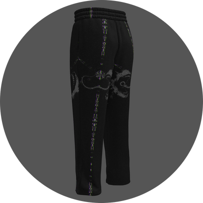 UN4RT - EYESCREAM all-over-print jogging pants back left view – black sweatpants with surrealist horror graphic showing screaming face with circular eyes, glitch distortion stripes along legs and elasticated waist.