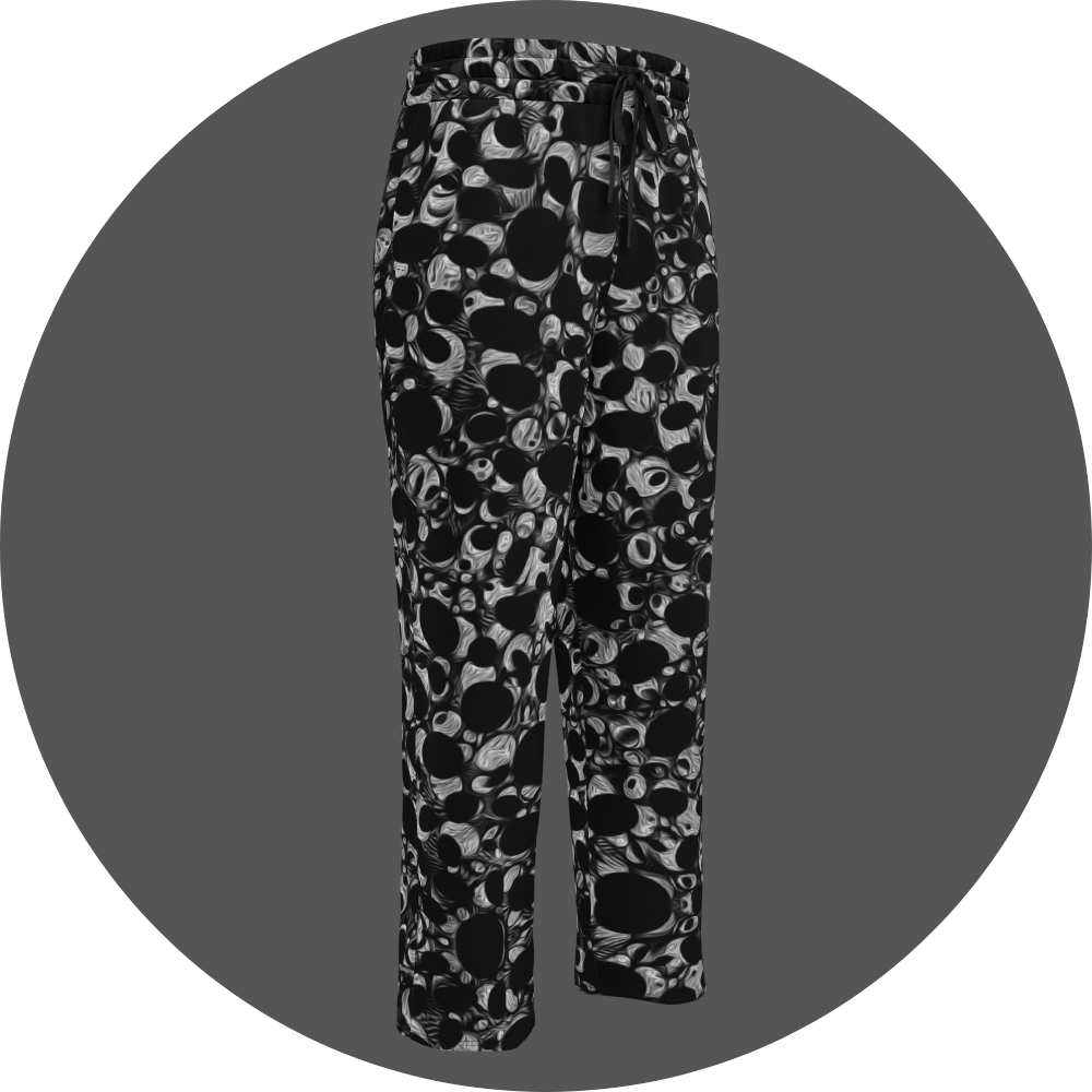 UN4RT eyesolation all-over-print jogging pants front right view – black sweatpants with dense abstract pattern of black organic blob shapes and grey brushstroke texture, elasticated drawstring waistband, straight leg cut.
