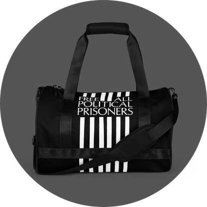 un4rt - the image shows the front side of a black tubular gym bag with six vertical white stripes in the middle. the stripes are interrupted with a text that reads: "free all political prisoners".