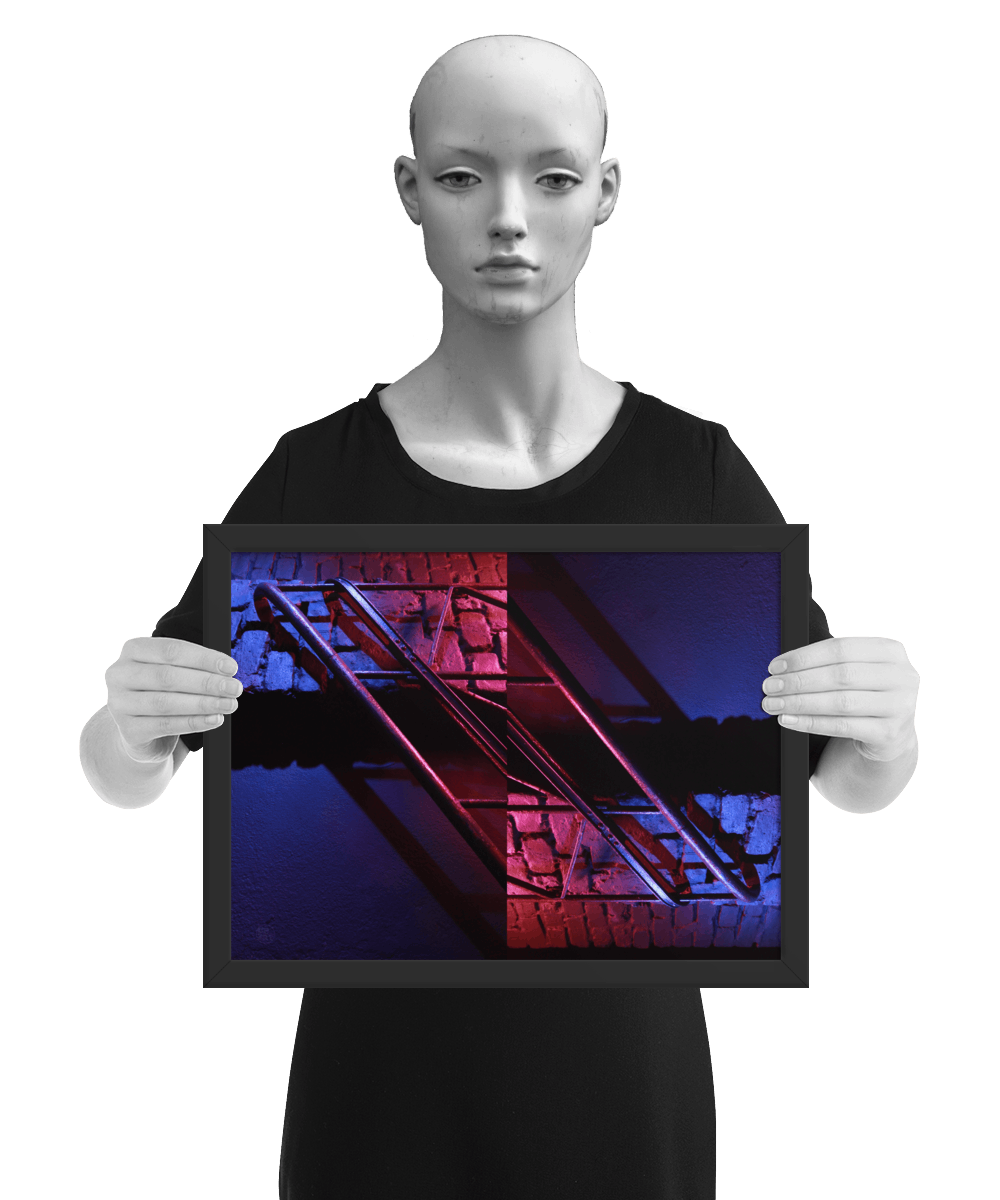 un4rt - the photographie is doubled and then mirrored. both photographies together create the final image. the image shows a brick wall and a wall with a handrail. the illumination changes from red to blue. the image is framed and presented by a mannequin in black and white.