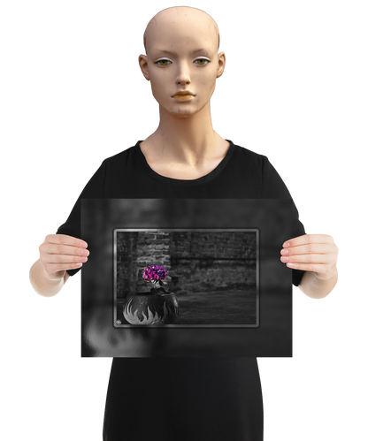 un4rt - the picture shows an edited photo. most of the picture is black and white. the main element is a hydrangea. the flowers of the hydrangea are colored. the colurs are blue and purple. the background is very blurred and only dimly visible. the picture was taken at the maze-club in berlin. the picture is presented by a mannequin.