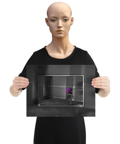 un4rt - the picture shows an edited photo. most of the picture is black and white. the main element is a hydrangea. the flowers of the hydrangea are colored. the colors are blue and purple. the background is very blurred and only dimly visible. the picture was taken at the maze-club in berlin. the picture is presented by a mannequin.