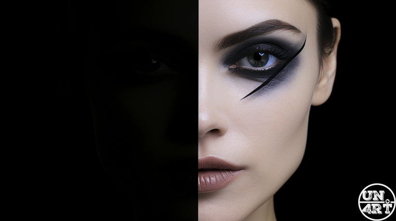 UN4RT imaginarium – half-face close-up of a woman with bold graphic black winged eyeliner and smoky eye emerging from total darkness, dark high-fashion beauty editorial photography.